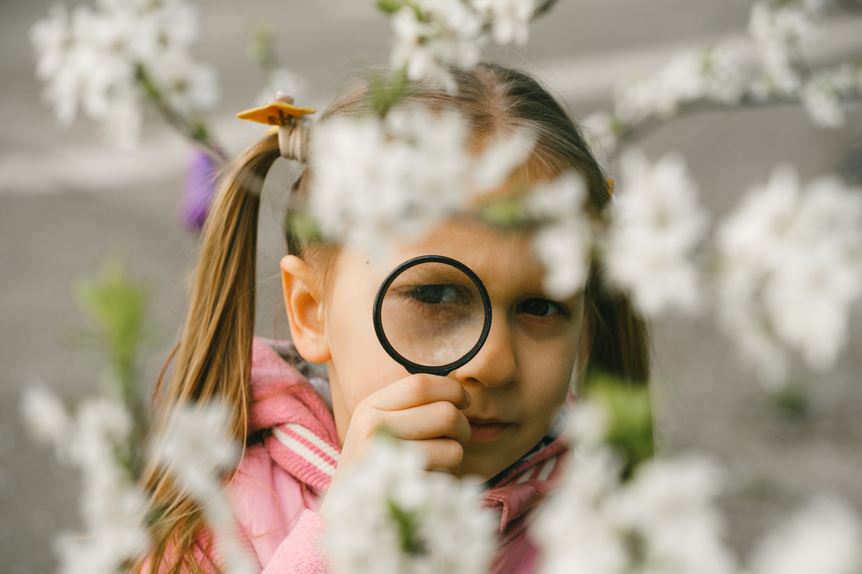 girl with magnifying glass