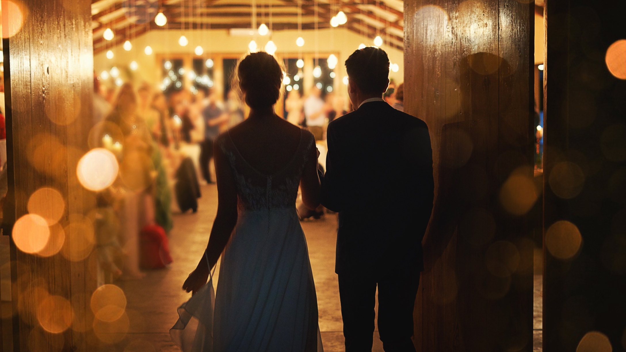 Bride and groom enter wedding reception