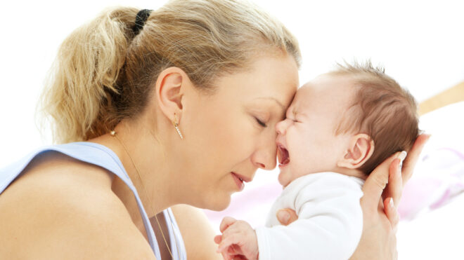 mom calming a crying baby