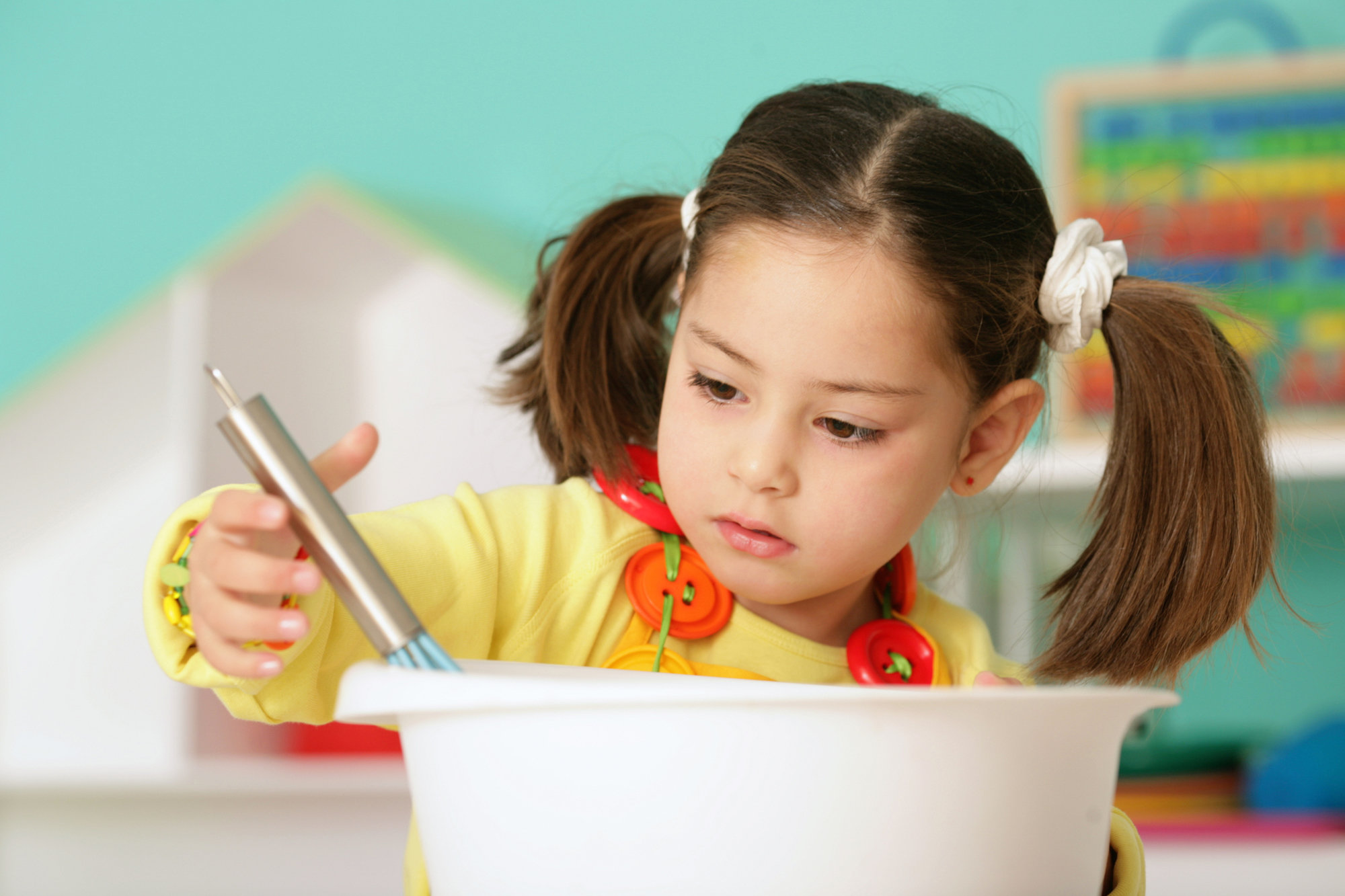 little girl mixing food