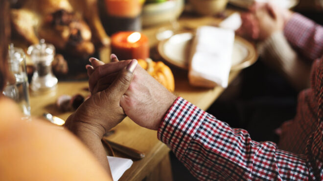 thanksgiving hand holding table