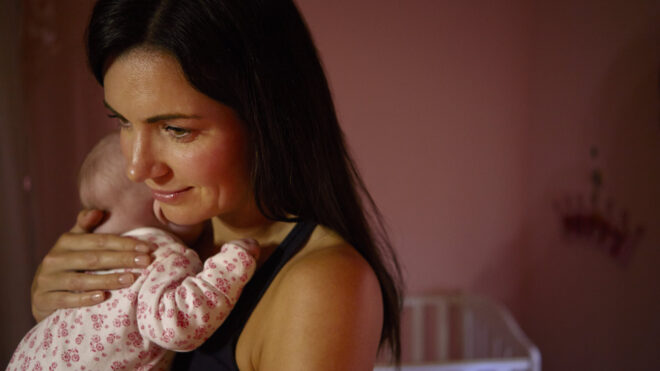 woman with baby at night