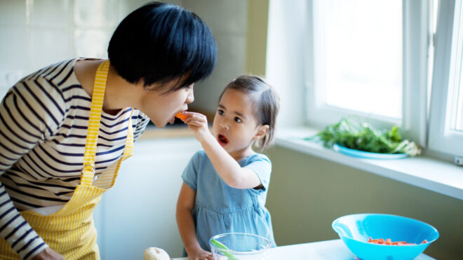 mom and daughter cooking