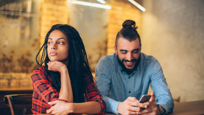 woman mad at her man on his phone