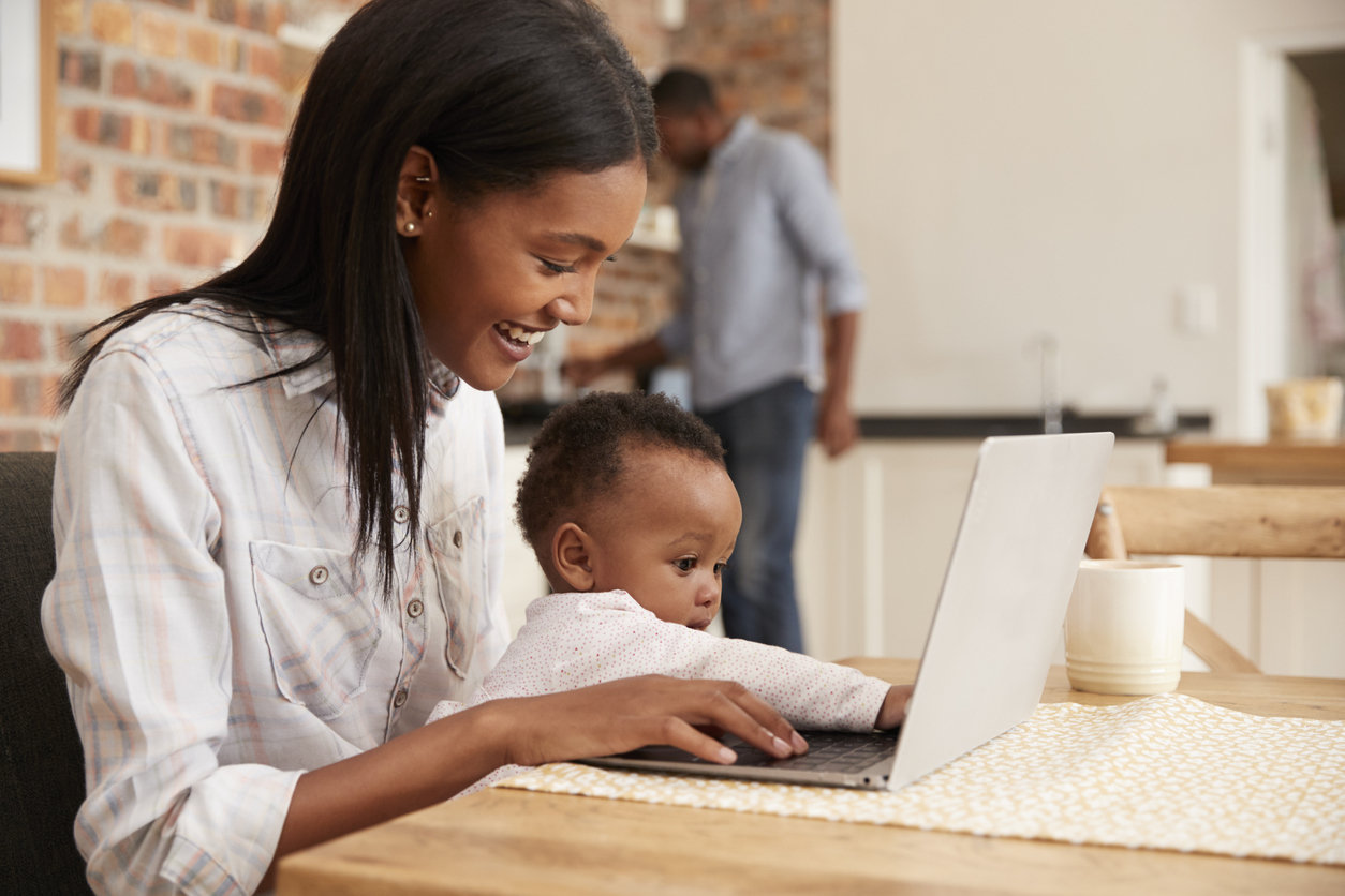 mom with baby and laptop