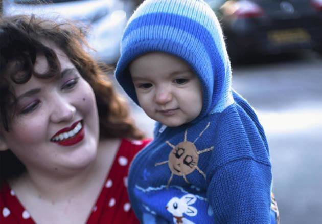 smiling plus size mom and baby