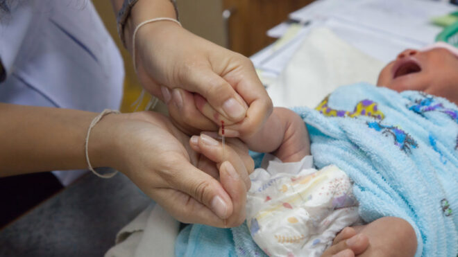 Midwife with newborn baby