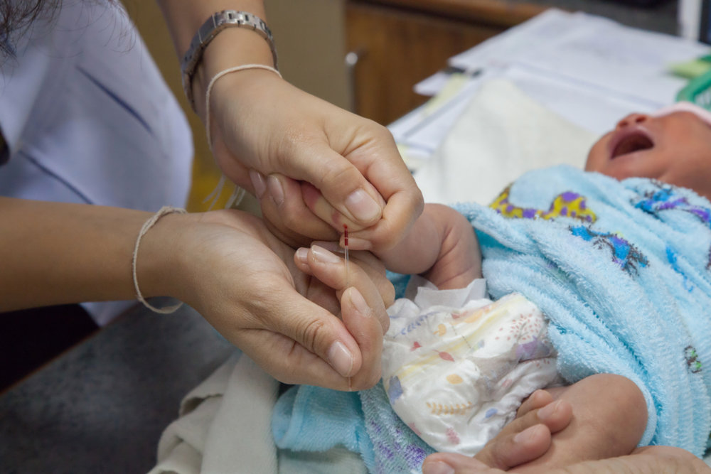 Midwife with newborn baby