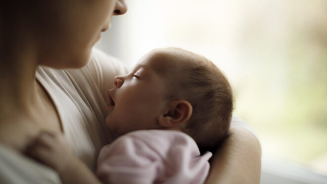 mom holding newborn baby