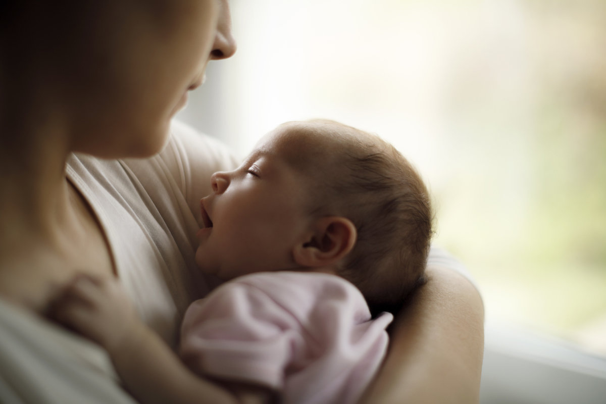 mom holding newborn baby
