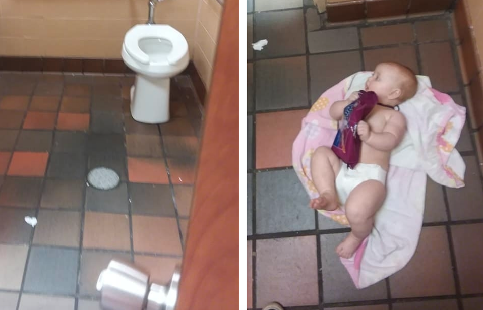 Dad changing diaper on the floor