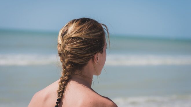 woman wearing a braid on the beach