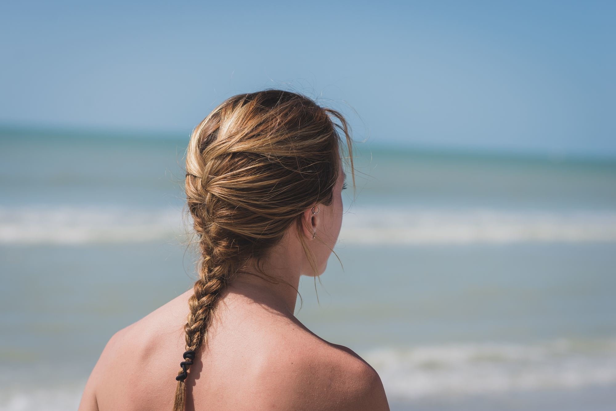 woman wearing a braid on the beach