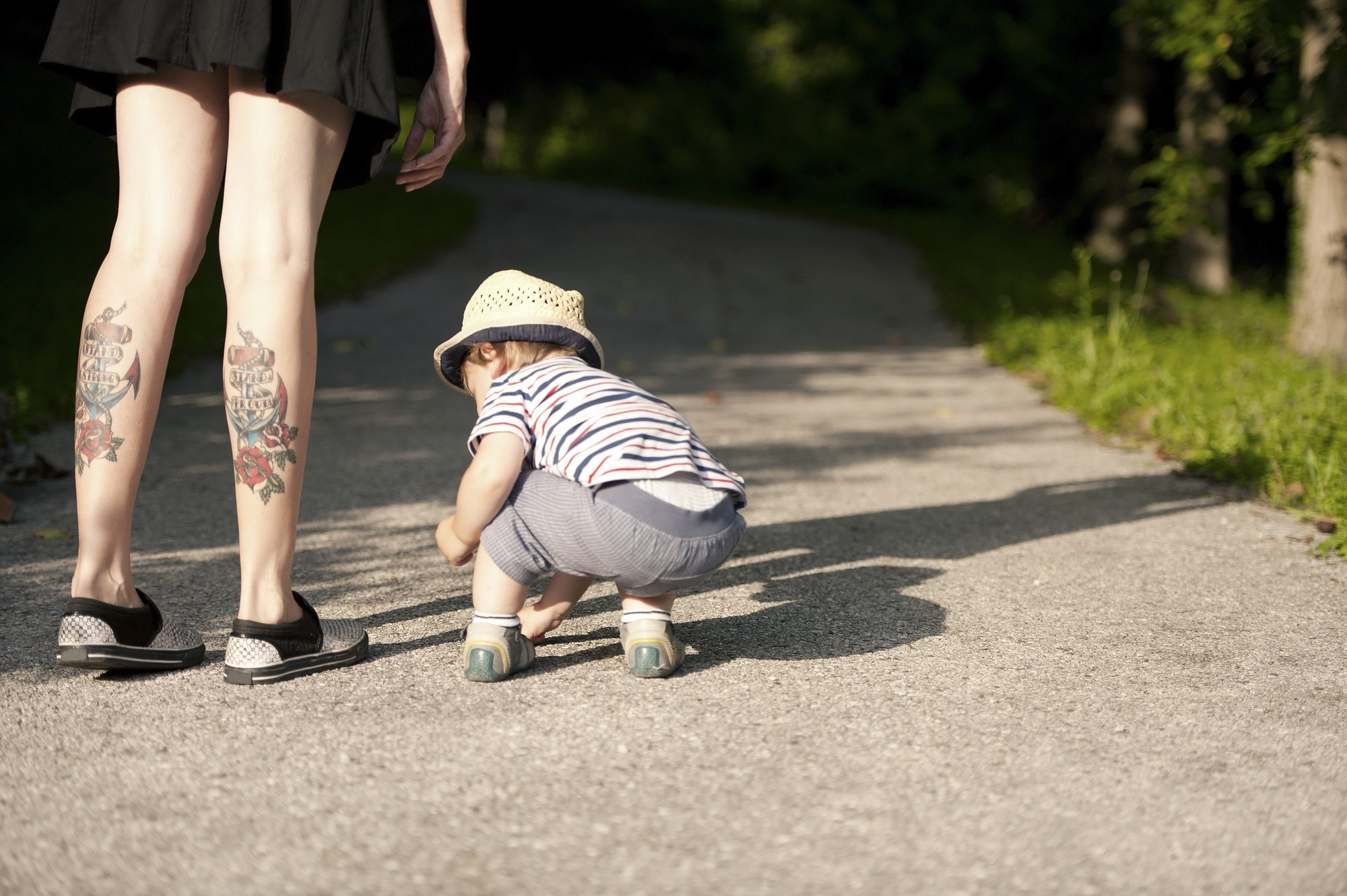 mom with tattoos holding baby