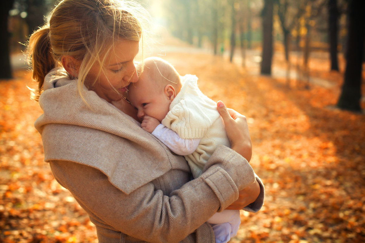 mom with baby in the fall