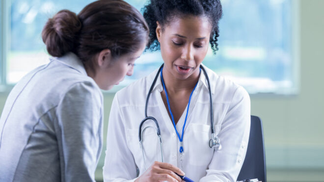 woman talking to doctor