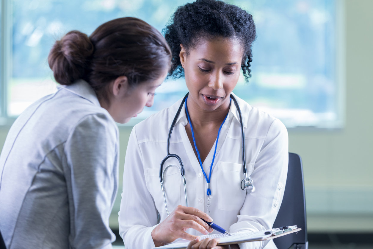 woman talking to doctor