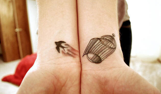 caged bird tattoo