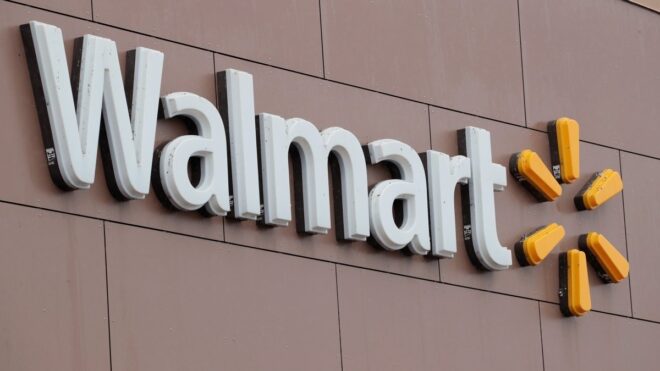 Close-up of a Walmart sign on a local storefront.