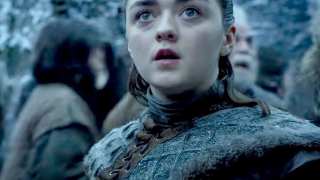 Arya Stark from Game of Thrones looks past the camera intensely.