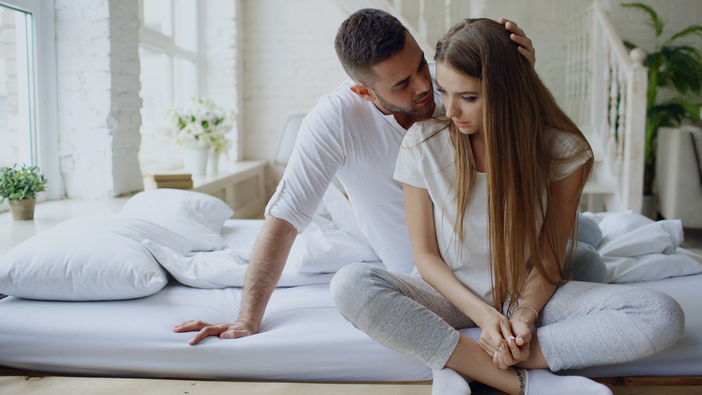 couple talking in bed