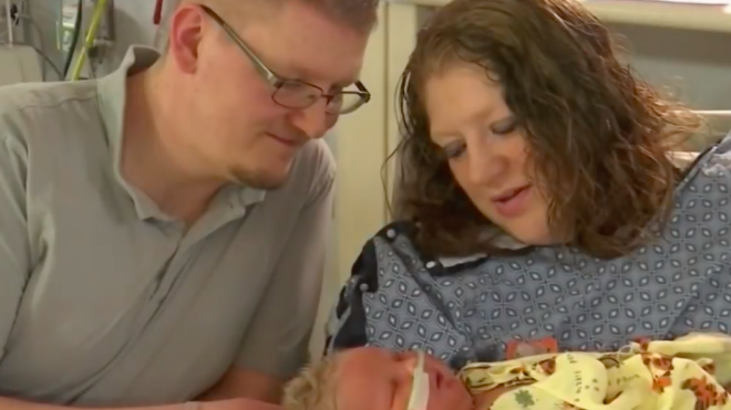 Joy Buckley and her husband visit their daughter Harper in the NICU.