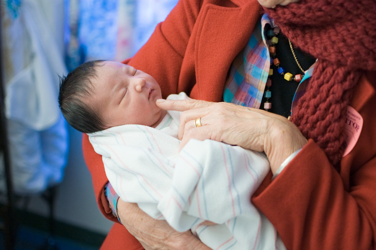 grandma holding new baby