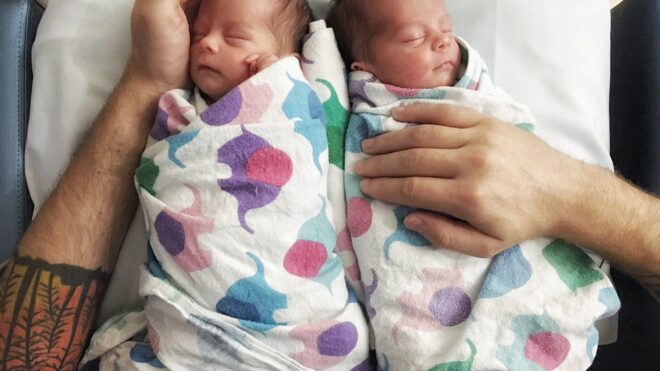 New dad holds twins