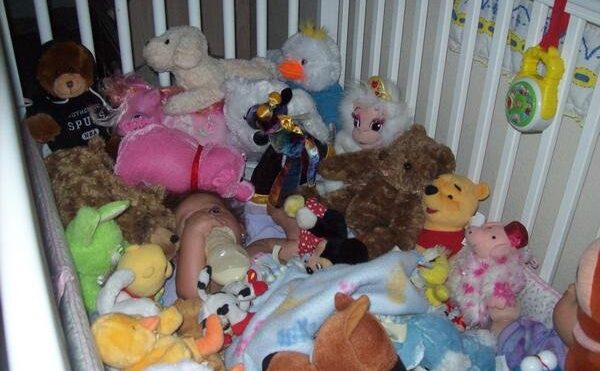 stuffed animals in the crib