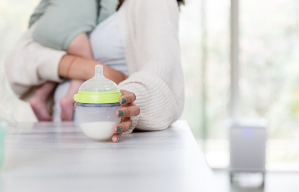 mom feeding baby formula