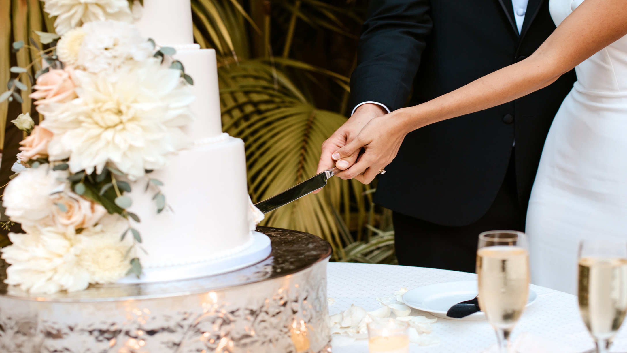 couple cutting wedding cake