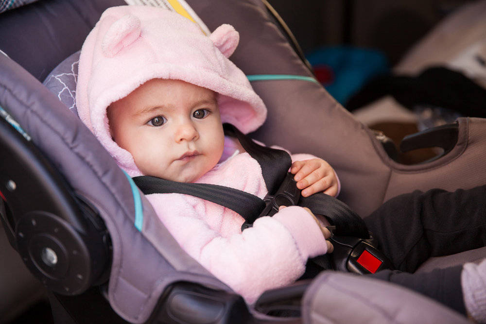 baby girl in a car seat