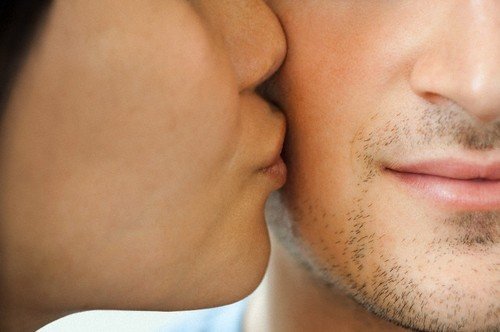 woman kissing man
