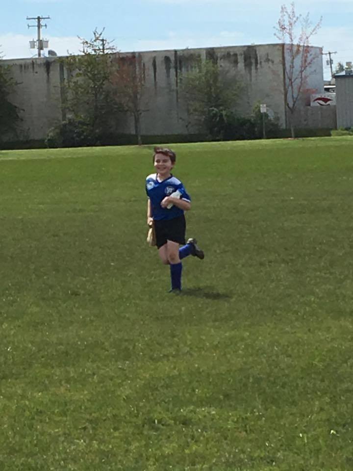 boy playing soccer