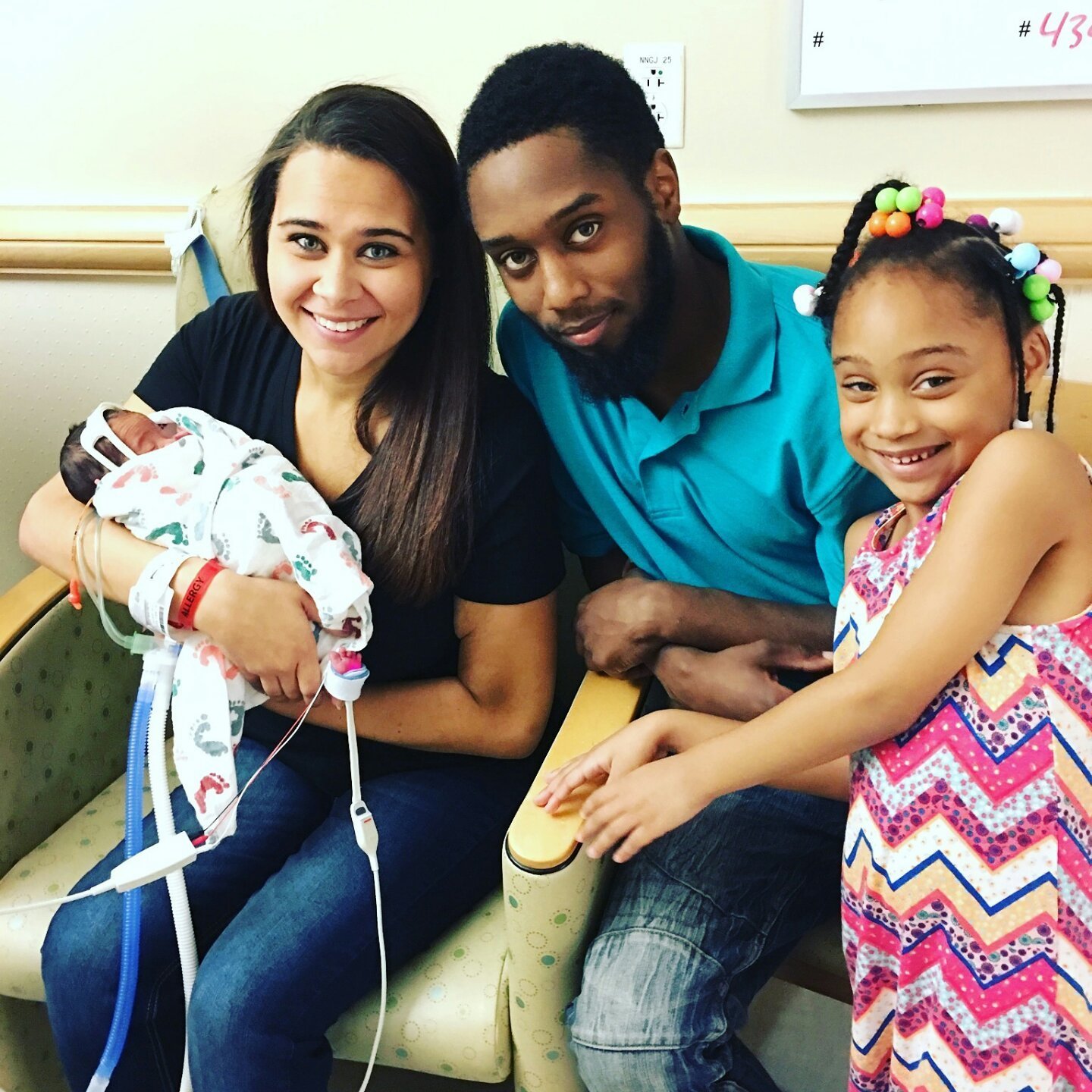 Newborn baby with family