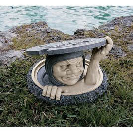 manhole garden sculpture