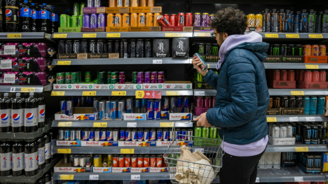 Man buying energy drinks