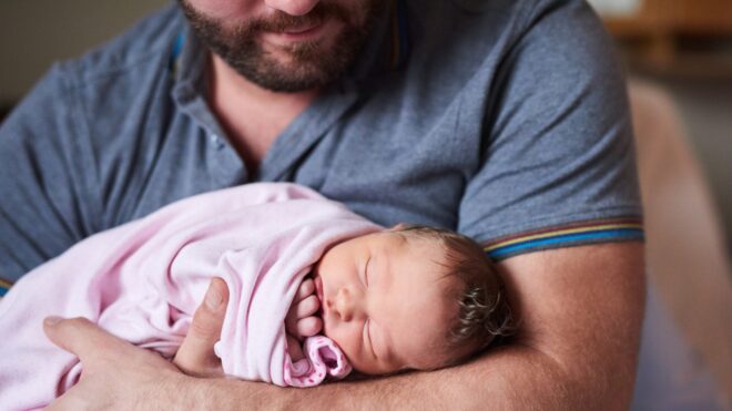 man holding baby