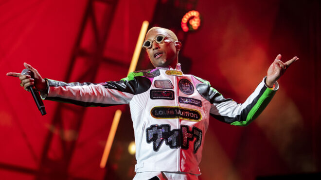 Pharrell Williams performing on stage