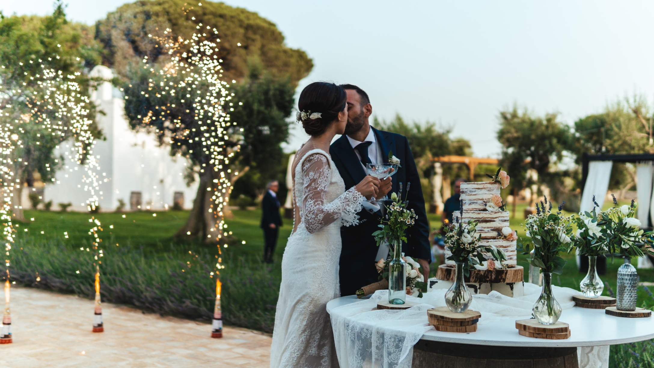 Bride and groom kiss during wedding reception