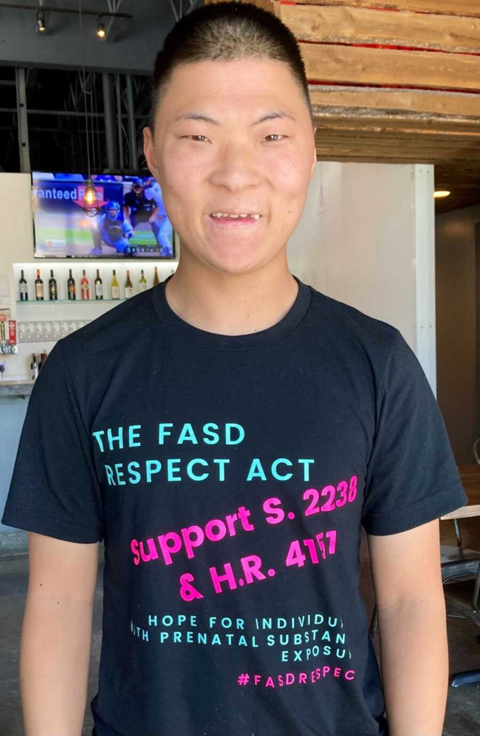 FASD-survivor-wearing-awareness-shirt-900x1380-1.jpg