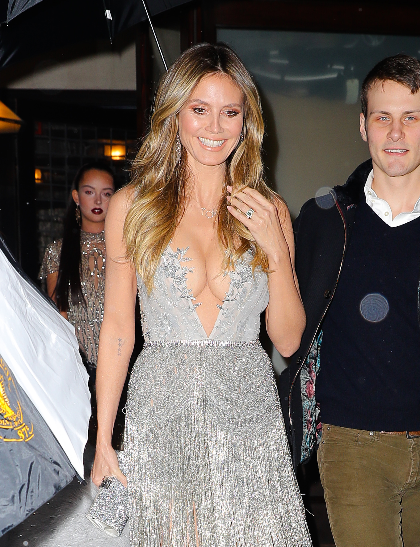 Heidi Klum Shows Major Cleavage while all smiling leaving her hotel in New York City
