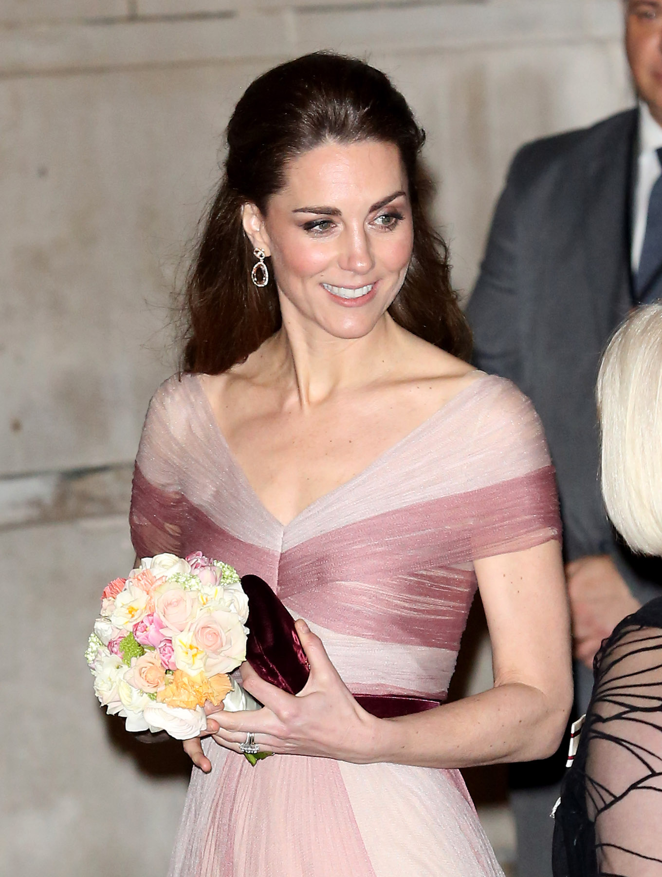The Duchess Of Cambridge Wears A Delicate Pink Gucci Gown As She Leaves The 100 Women In Finance event At The Victoria & Albert Museum.
