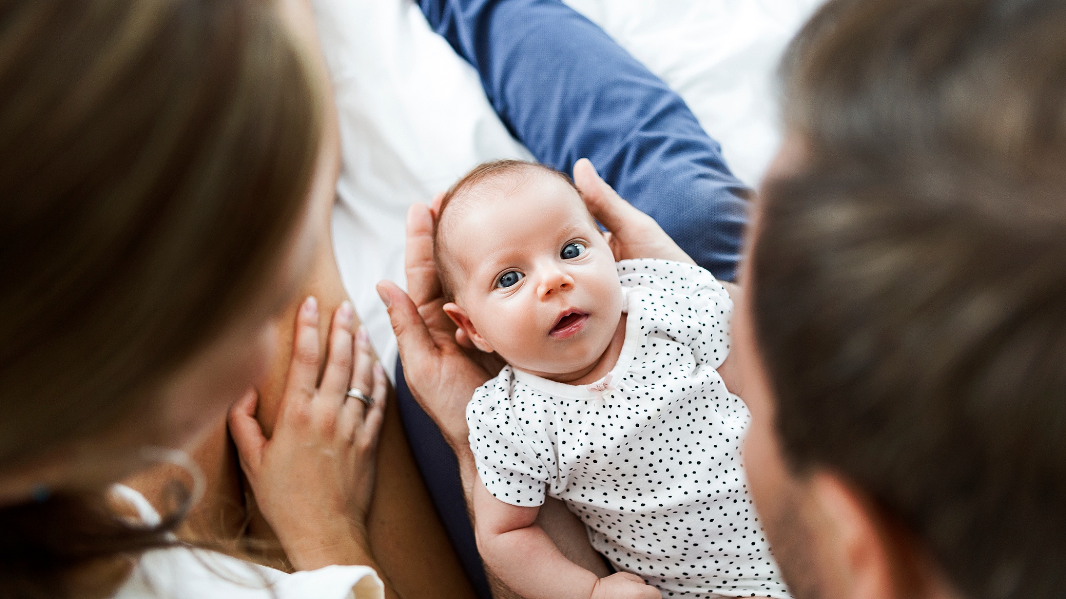 Parents-holding-baby