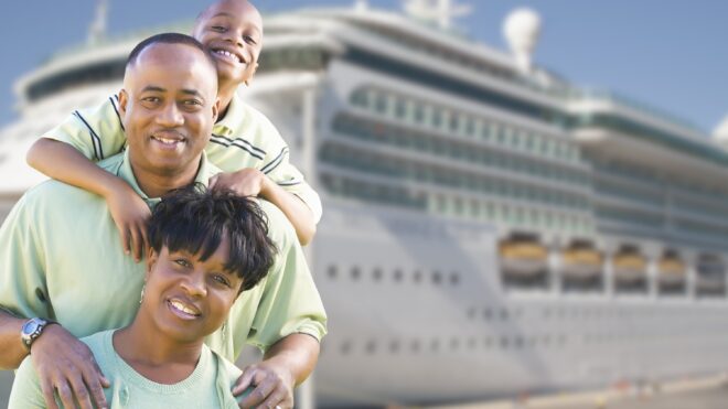 family in front of cruise ship