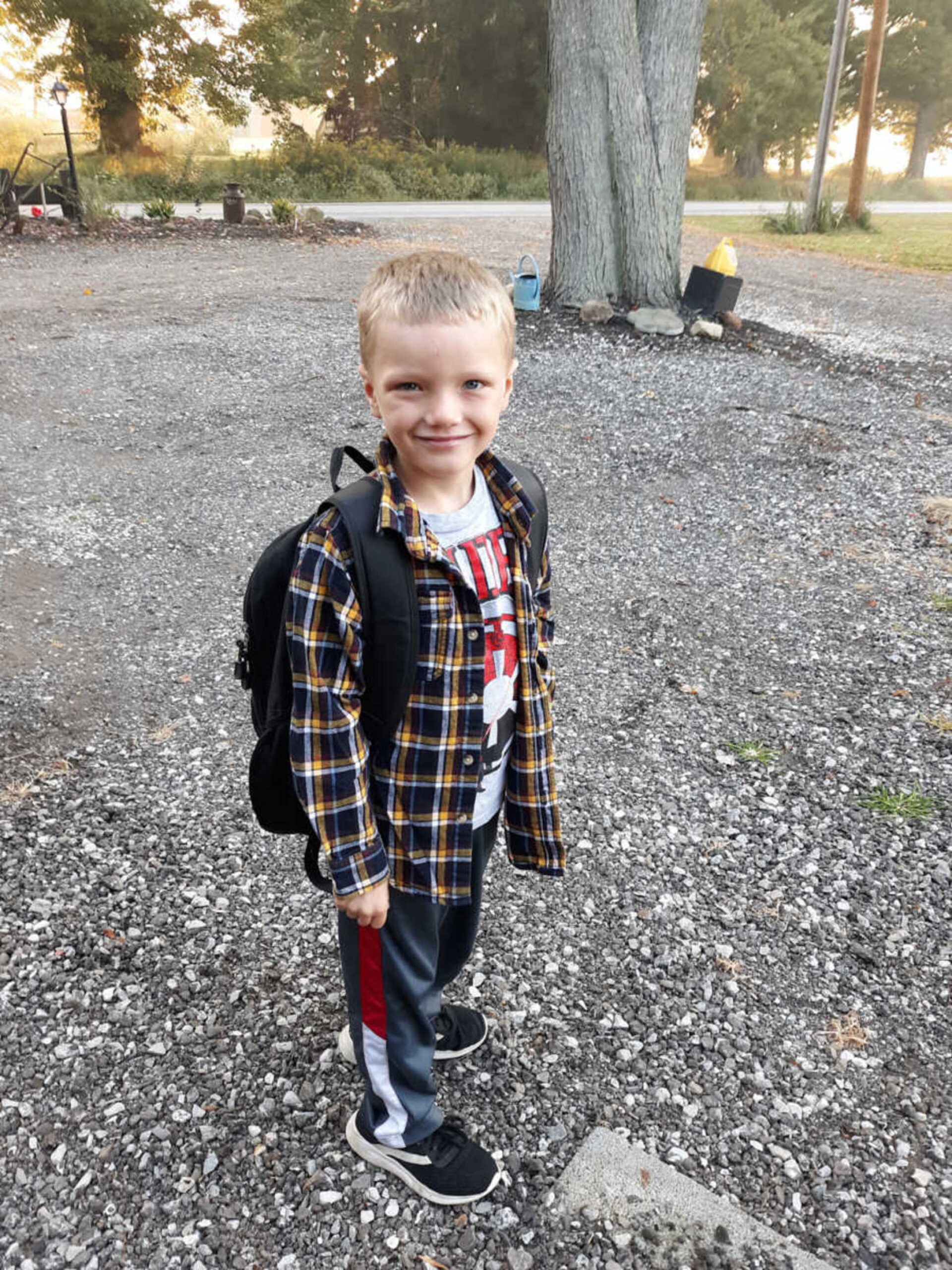 adopted-boy-smiling-wearing-backpack-900x1200-1.jpg