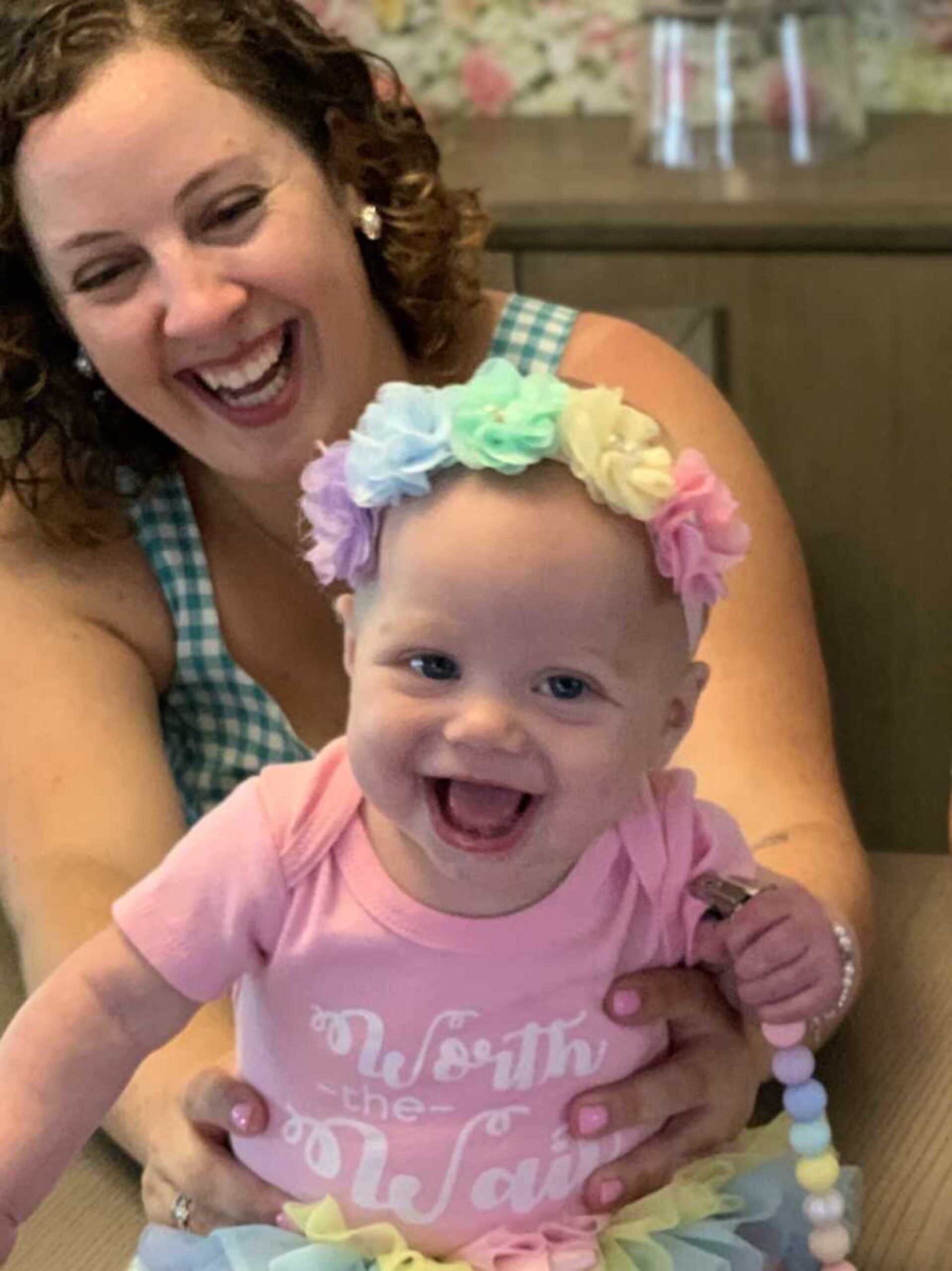 adoptive-mom-holding-daughter-wearing-pink-shirt-900x1201-1.jpeg