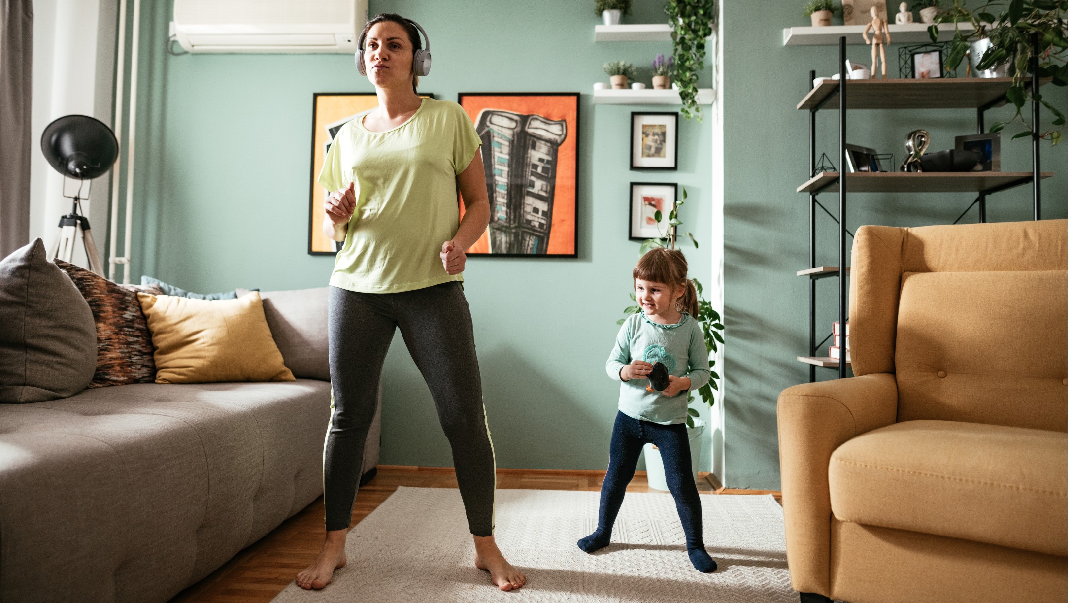 adult-woman-dancing-at-home-during-quarantine-with-three-year-old-picture-id1216459532.jpg