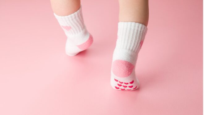 Baby feet with pink socks