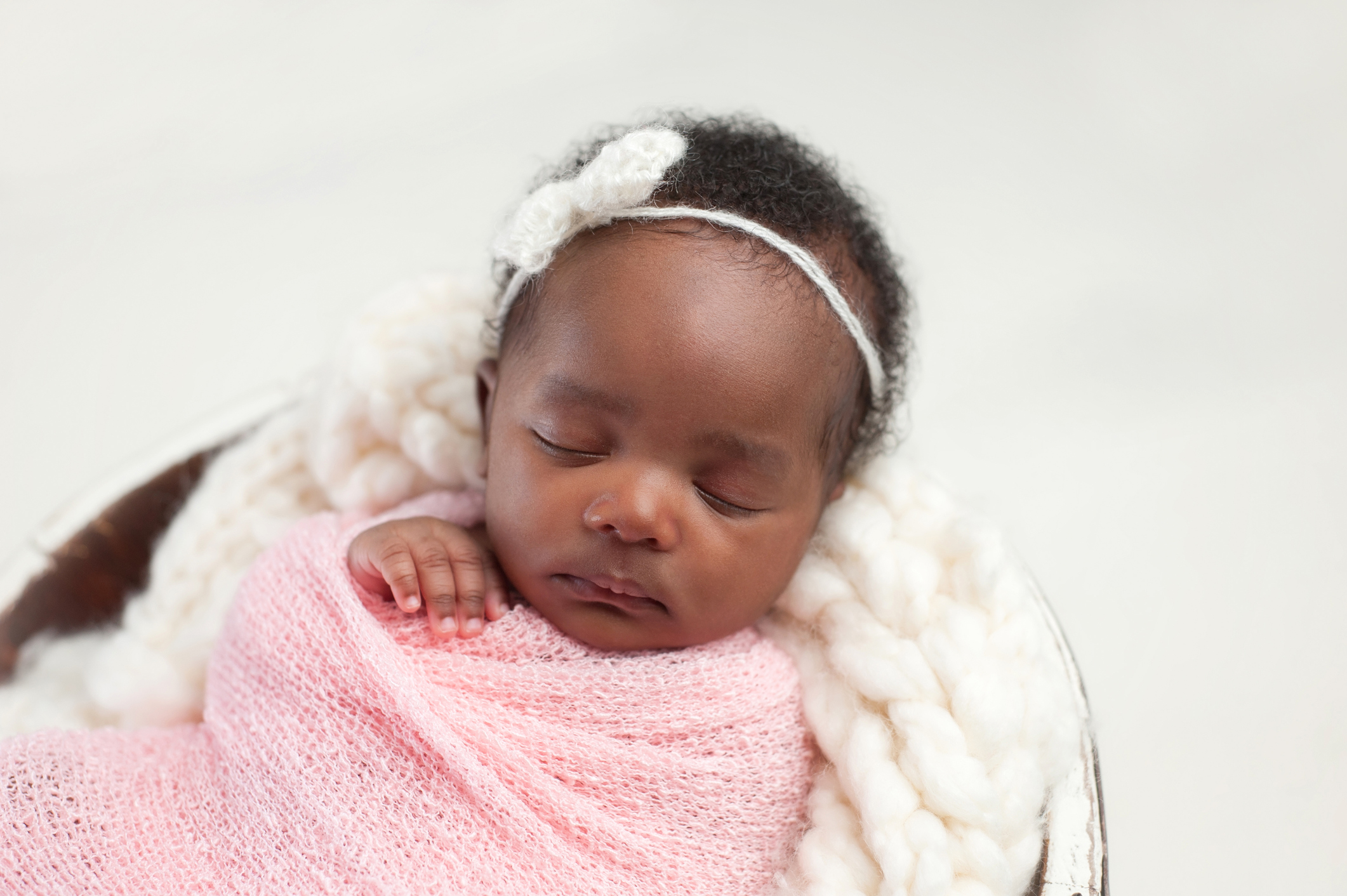 Newborn Baby Girl Sleeping in Bowl